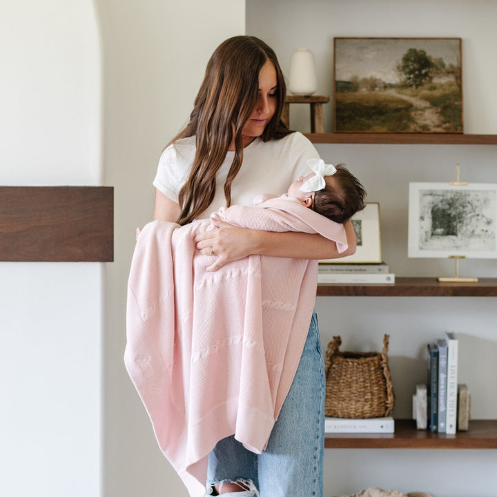 Pink Saranoni Heirloom Cotton Knit Receiving Blankets shown rolled, highlighting classic knit texture as a baby boy blanket.