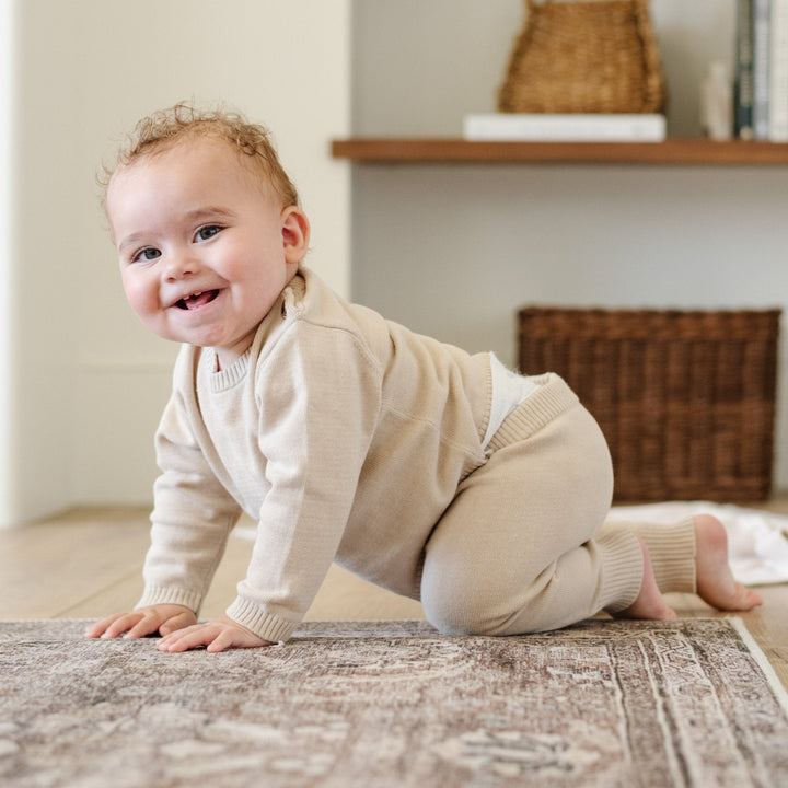 SaranoniÕs Heirloom Cotton Knit Set in Tan redefines comfort, offering timeless appeal for baby boy clothing.