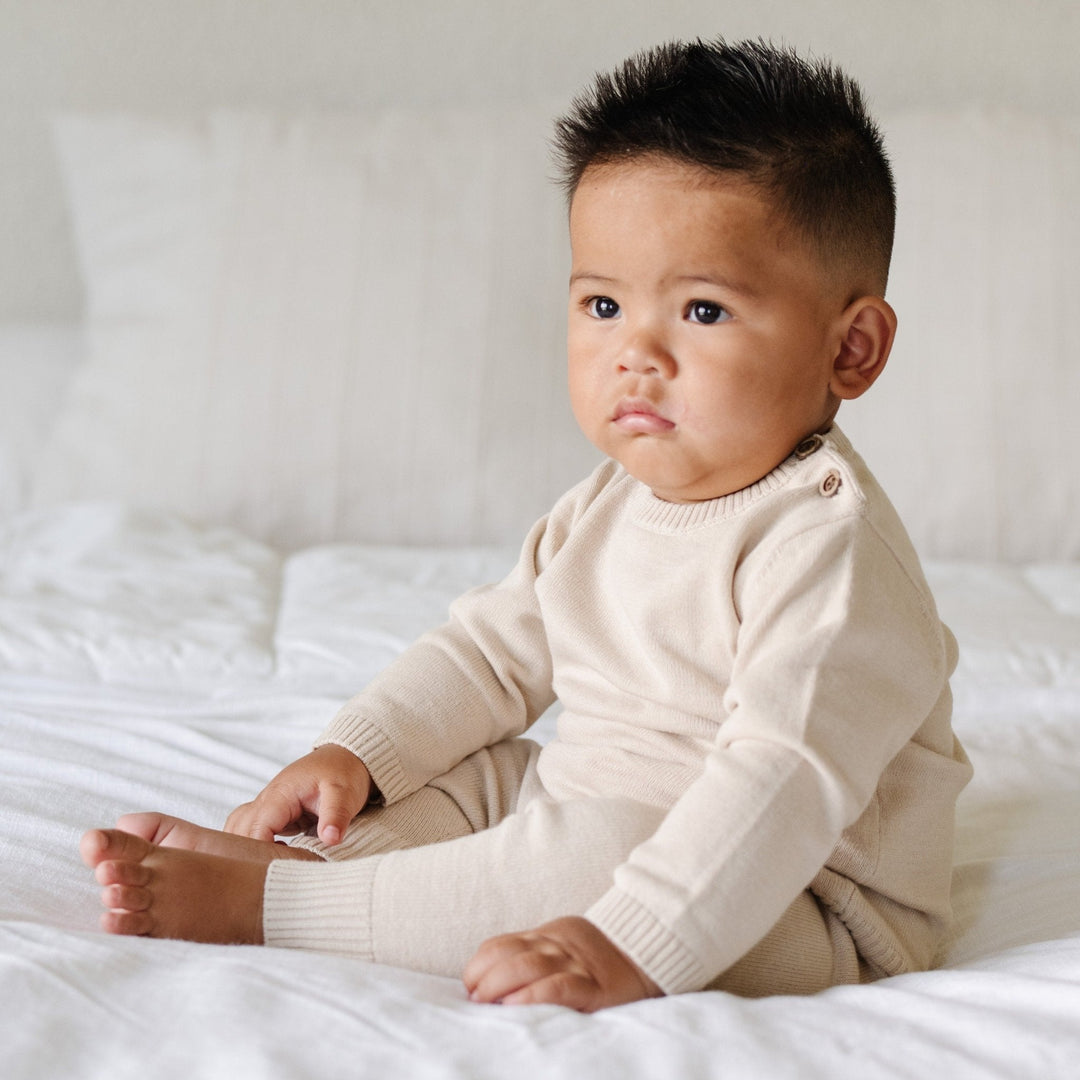 Cozy and classic, the Tan Saranoni Heirloom Cotton Knit Set delivers the perfect mix of warmth and modern style.