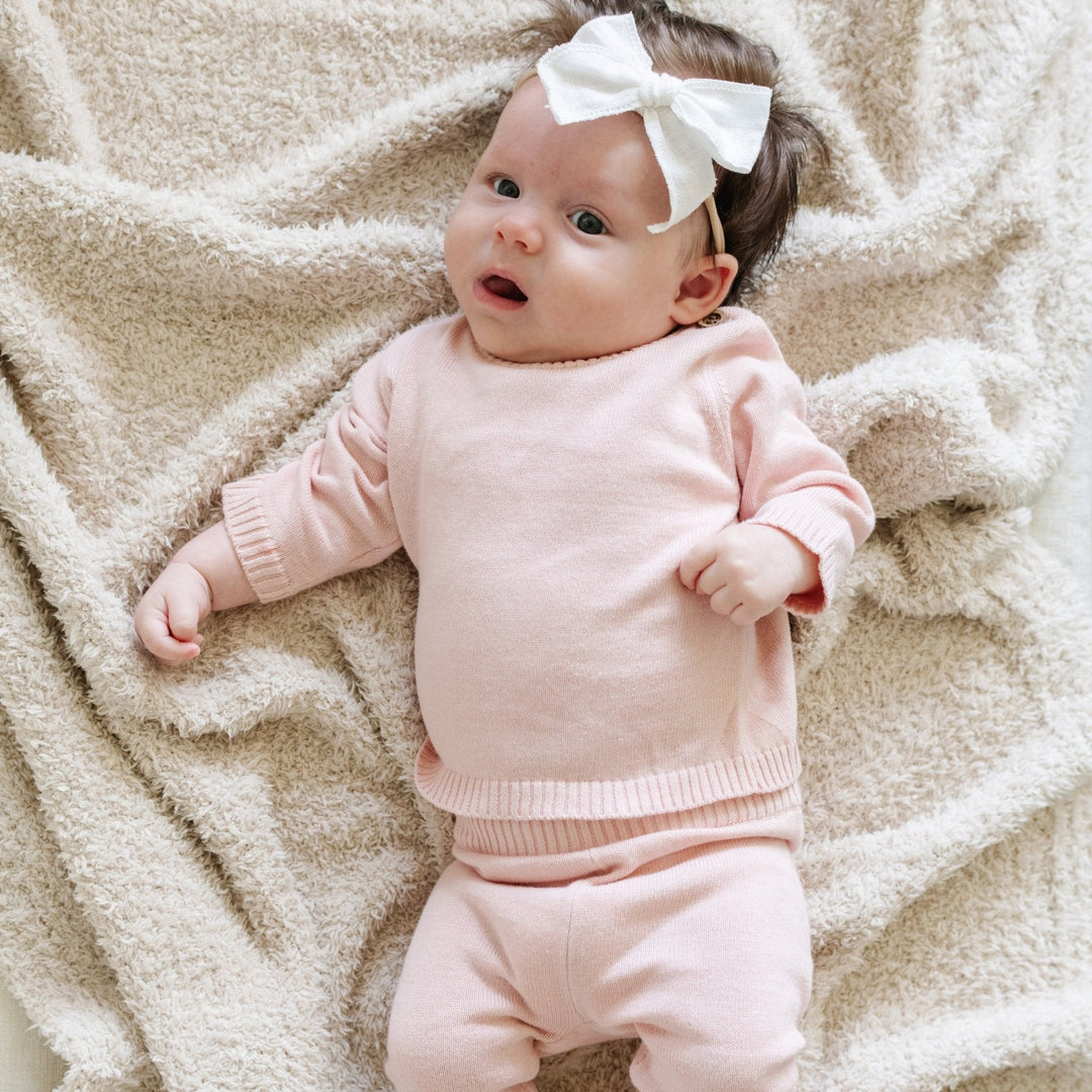 Refined yet cozy, the Pink Saranoni Heirloom Cotton Knit Set stands out as a stylish choice in baby boy clothing.