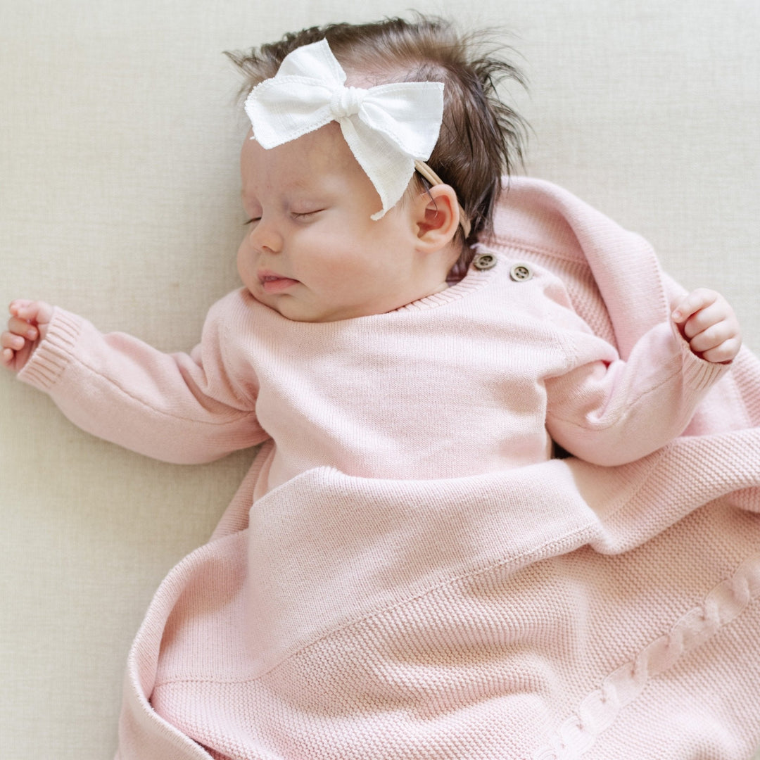 The Pink Saranoni Heirloom Cotton Knit Set makes dressing your baby girl both elegant and effortless.