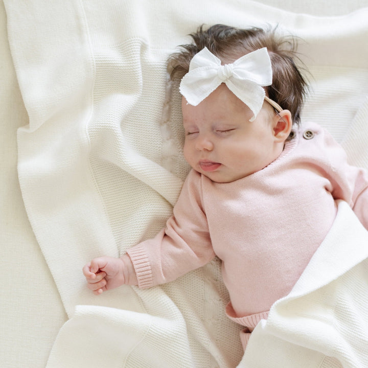 Designed for everyday wear, the Pink Saranoni Heirloom Cotton Knit Set is a staple in cute baby clothes collections.