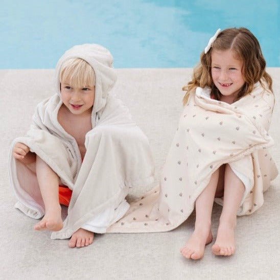 Cuddle your toddler in Saranoni Hooded Towels in Tulips and Feather, soft toddler towels made for warmth.