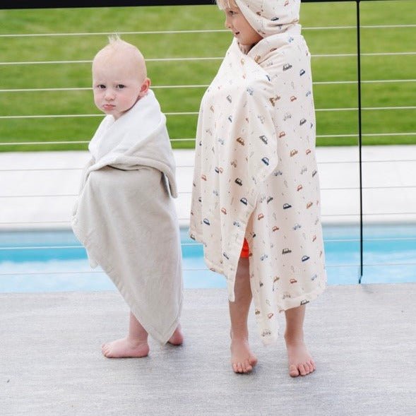 Wrap your little one in Saranoni Hooded Towels in Feather and Cars, a cozy baby hooded towel for post-bath warmth.