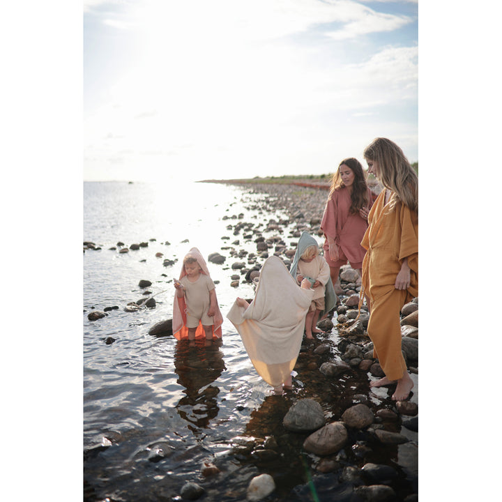 Mushie Hooded Towel made of soft absorbent material to keep your baby dry