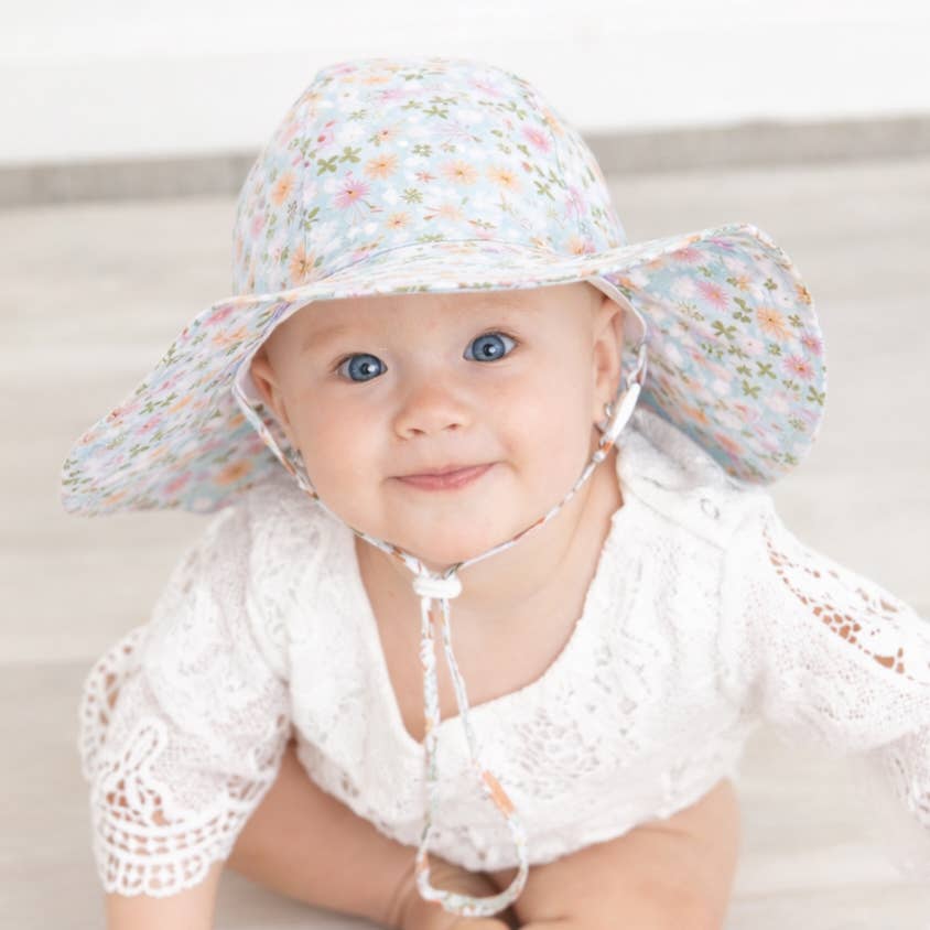 blue baby sun hat with pink and orange flower pattern by huggalugs 