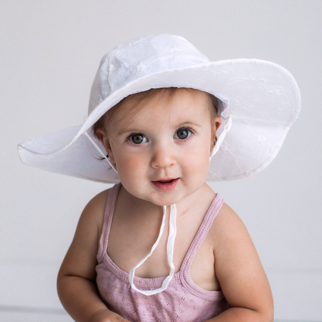 toddler wearing huggalaggs girl white floral sun hat 