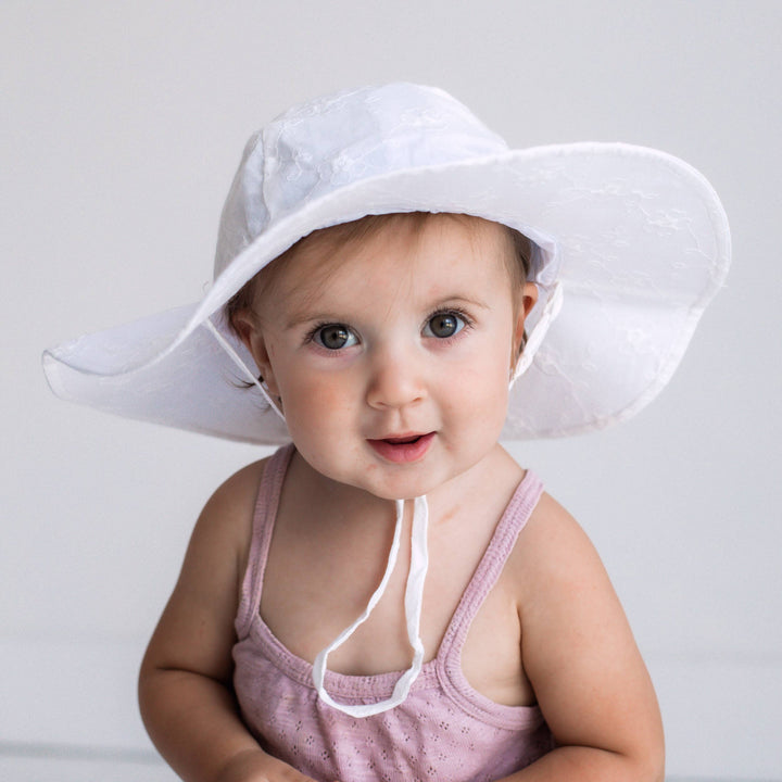 toddler wearing huggalaggs girl white floral sun hat 