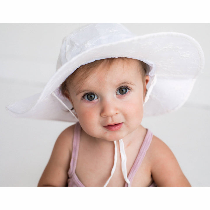 huggaluggs white baby and toddler sunhat with embrodered flower design 