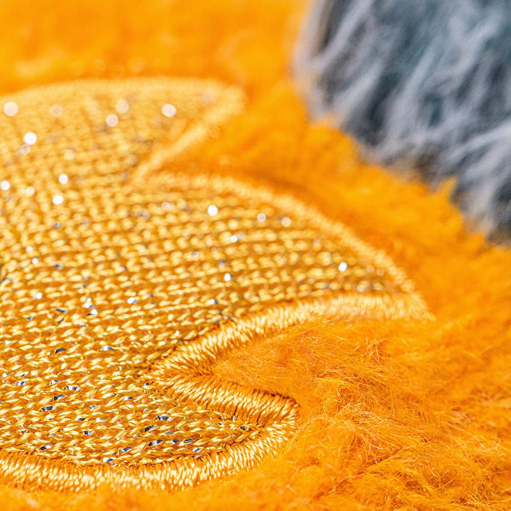 Jellycat Amuseables Space Comet close up texture detail bright orange plush comet with embroidered star detail soft stuffed toy collectible