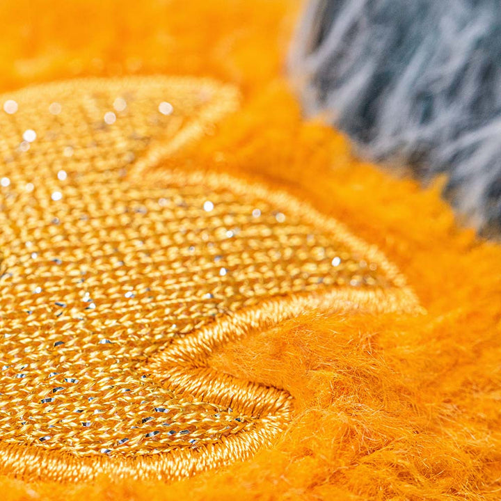 Jellycat Amuseables Space Comet close up texture detail bright orange plush comet with embroidered star detail soft stuffed toy collectible
