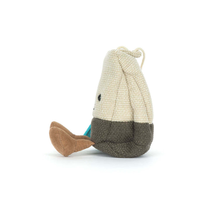 Side view of the Amuseables Steepy Tea Bag by Jellycat, soft tea bag stuffed animal with brown cord legs