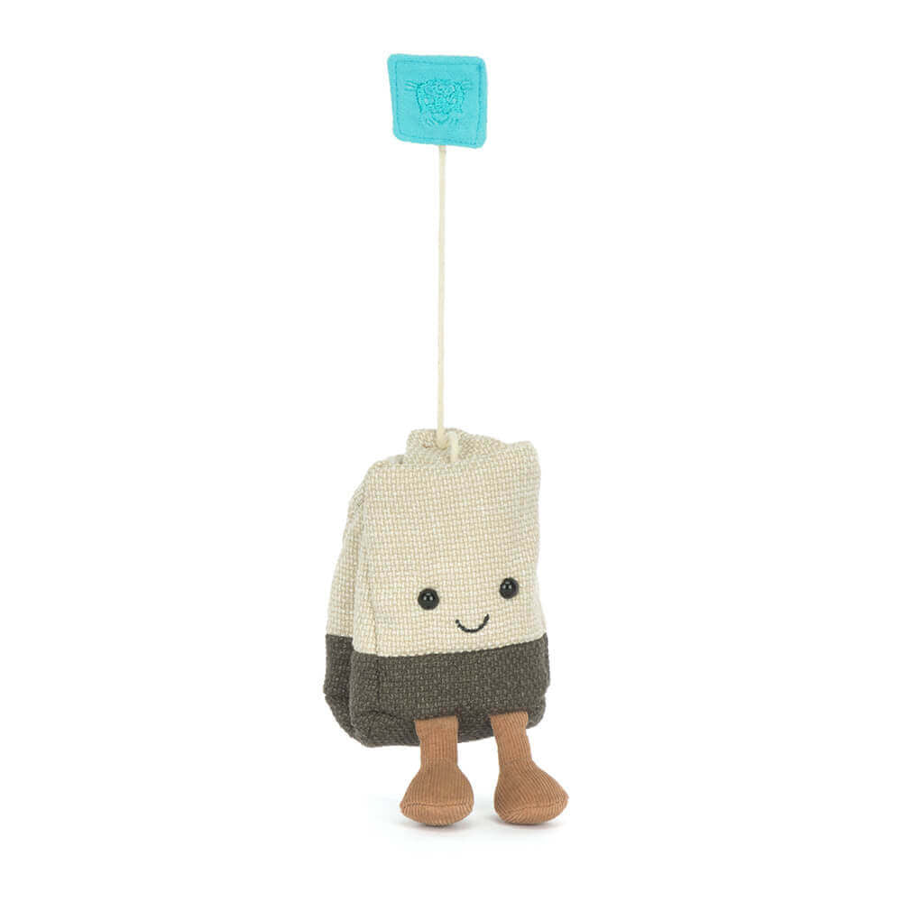 Jellycat Amuseables Steepy Tea Bag hanging by its tag string -- whimsical tea bag plush toy