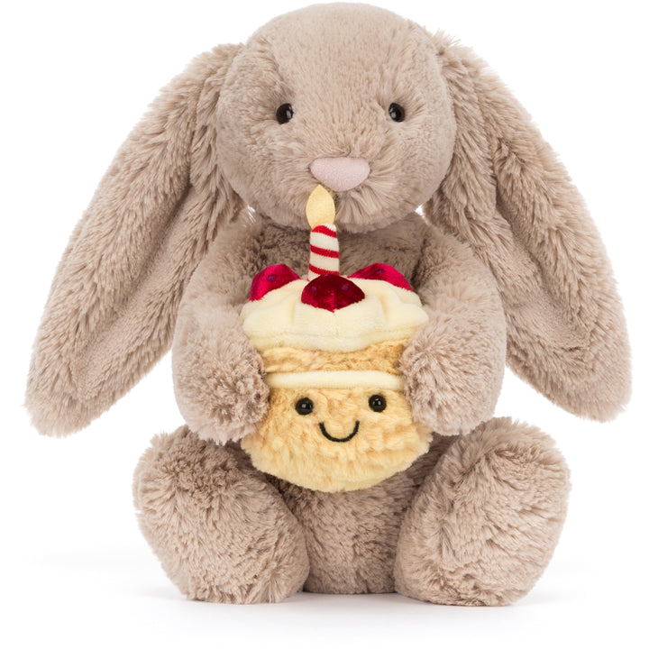 beige bashful jellycat bunny stuffed animal holding cake 