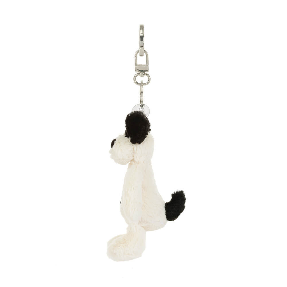 Side view: Jellycat dog bag charm, Rufferty Puppy plush keychain with fluffy cream fur