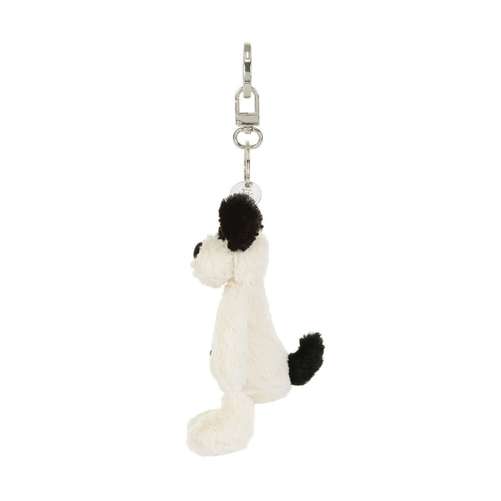 Side view: Jellycat dog bag charm, Rufferty Puppy plush keychain with fluffy cream fur