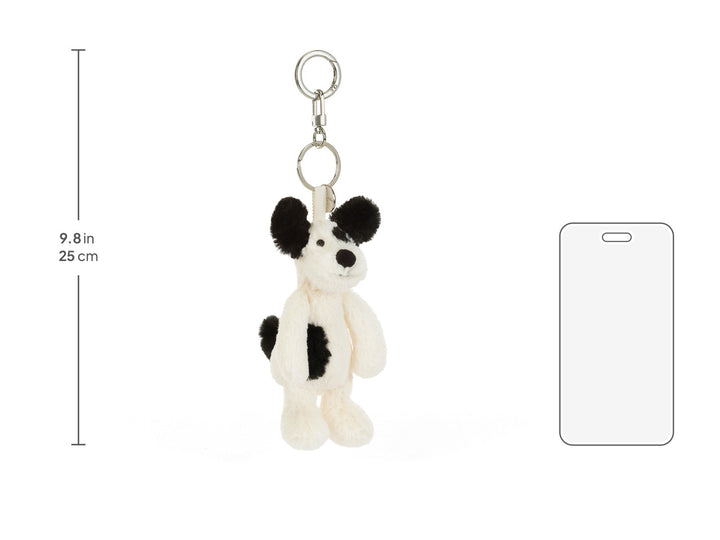 Size comparison: 9.8in Jellycat Rufferty Puppy Bag Charm next to phone, plush bag charm for backpacks