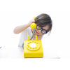 toddler with kiko wooden telephone