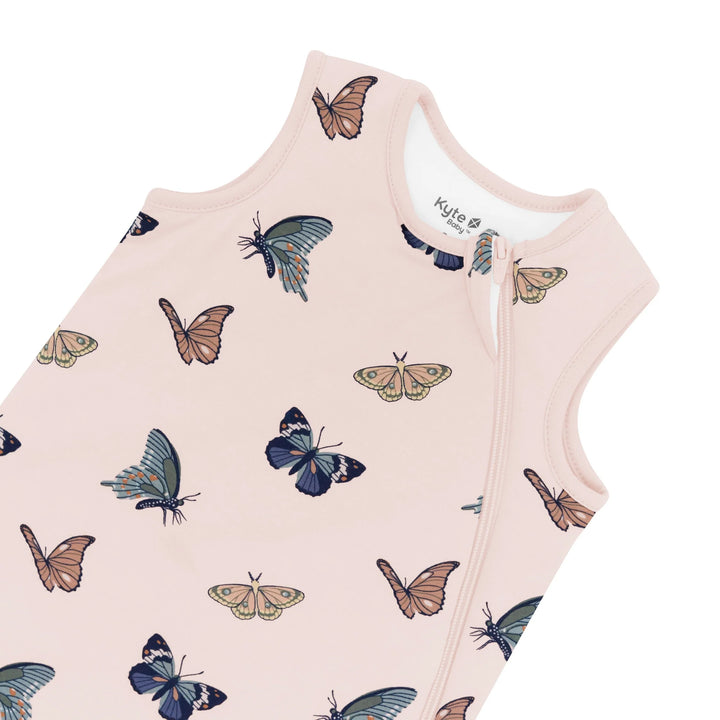 Delicate Blush Butterfly design wraps the Kyte Baby Sleep Sack Tog 1.0 in cozy baby sleep sacks