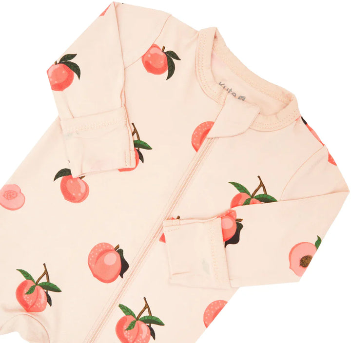 Lightweight bamboo footie pajamas in Peach, by Kyte Baby, keep babies snug through the night.