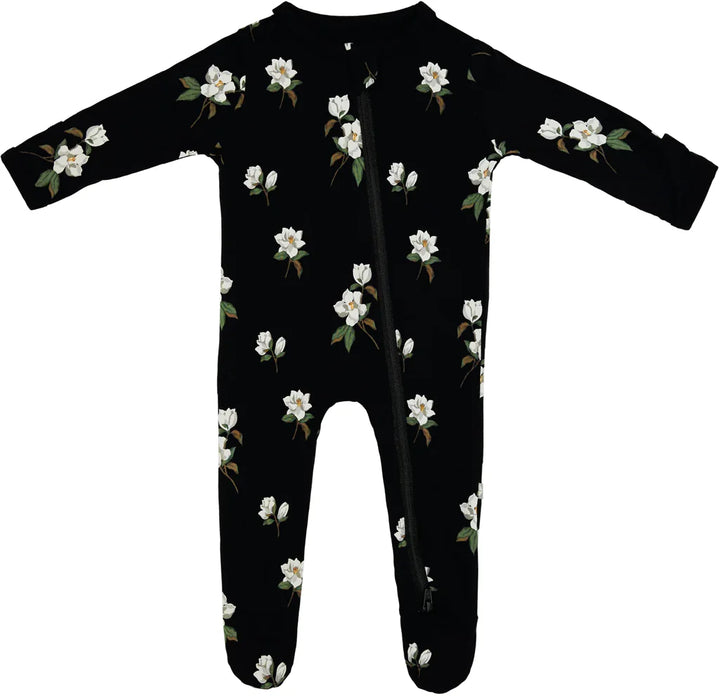 Wrap baby in soft comfort with the Midnight Magnolia Kyte Baby Zippered Footie baby pajamas.