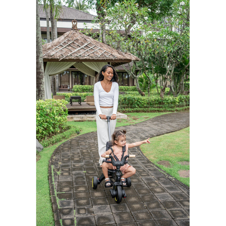 mom and child having fun with doona liki trike