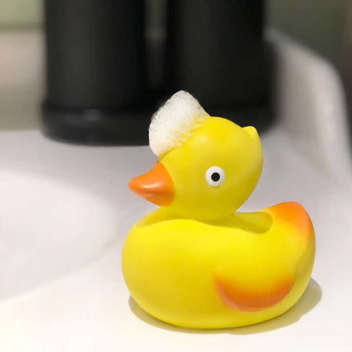 CaaOcho rubber duck bath toys for 1-year-olds, ideal for early water play exploration.