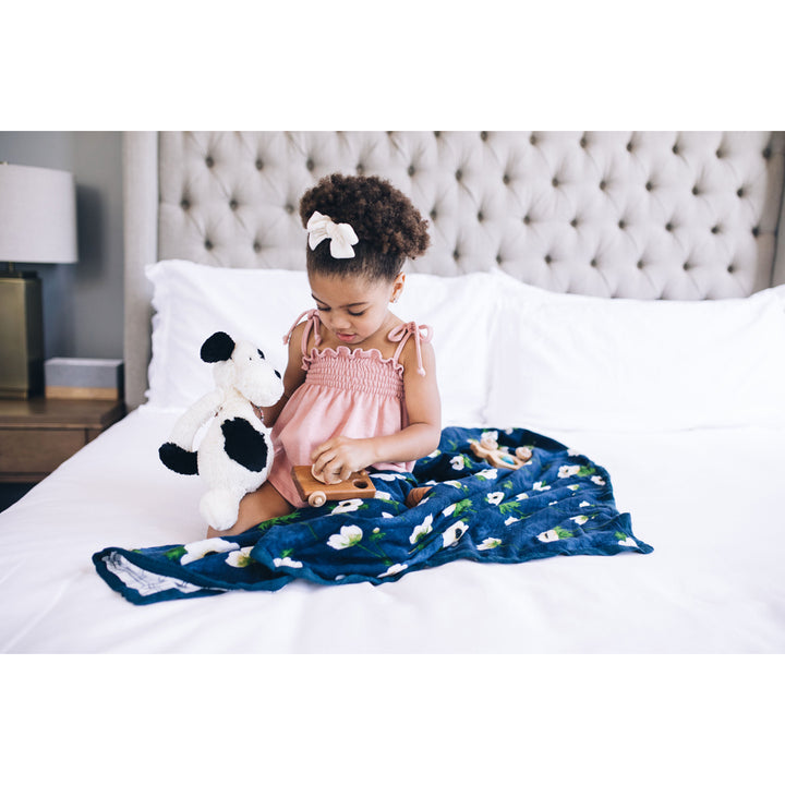 Cuddle-ready comfort with the Little Unicorn Deluxe Muslin Quilt - White Anemone, the ideal baby quilt.