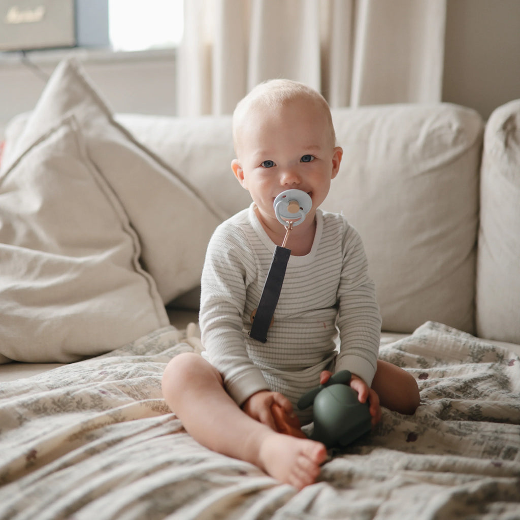 toddler with frigg little viking pacifiers