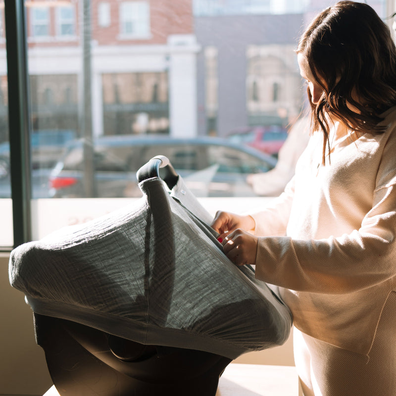 Beautiful ocean-inspired tone featured on the Little Unicorn Cotton Muslin Car Seat Canopy - Sea, a must-have car seat accessory.