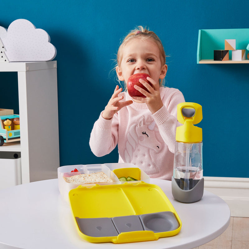 child eating apple from bbox jumbo bento lunch box in lemon sherbet