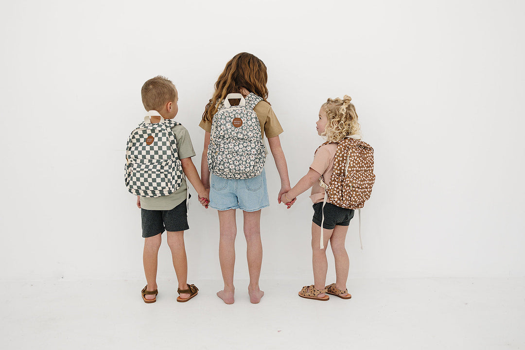 Child wearing the Mebie Baby Green Checkered Mini Backpack, a practical kid backpack designed for little explorers