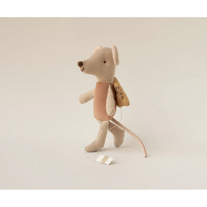 Set among stuffed dolls, the Maileg Fairy Mouse creates a charming and cozy moment.