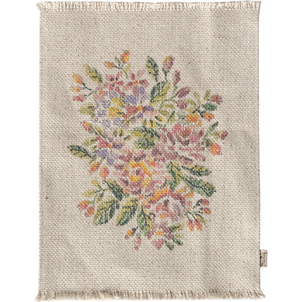 Add warmth to your dollhouse with the Maileg Miniature Rug in Flowers, a lovely dollhouse accessory for creative play.