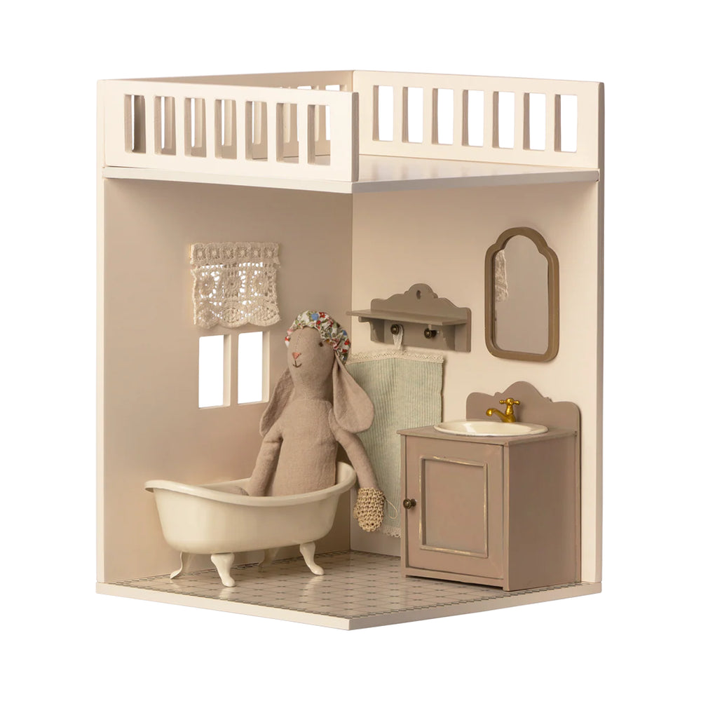 The Maileg House of Miniature Bathroom Extension displayed with sweet details to enhance your dollhouse setup.