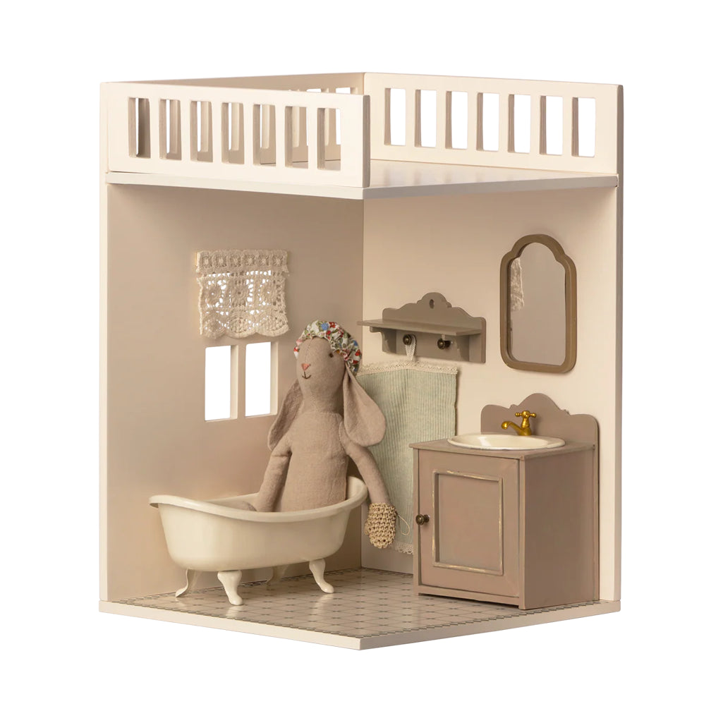 The Maileg House of Miniature Bathroom Extension displayed with sweet details to enhance your dollhouse setup.