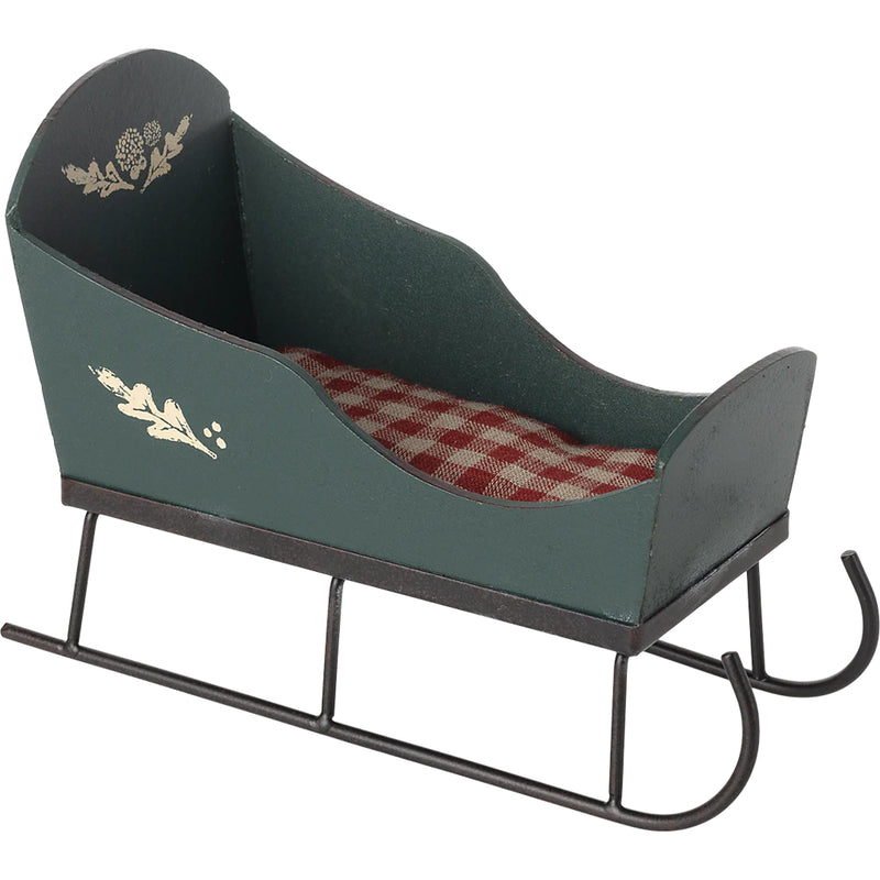 The Maileg Miniature Sleigh brings charm and holiday cheer to Maileg mice play areas.
