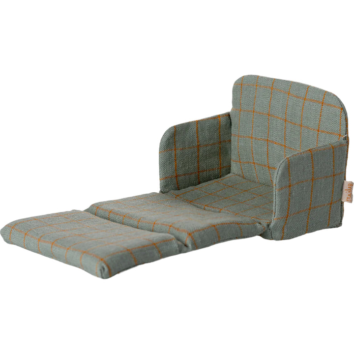 Miniature dollhouse accessories shine with the Maileg Mouse Sofa Bed as the centerpiece.
