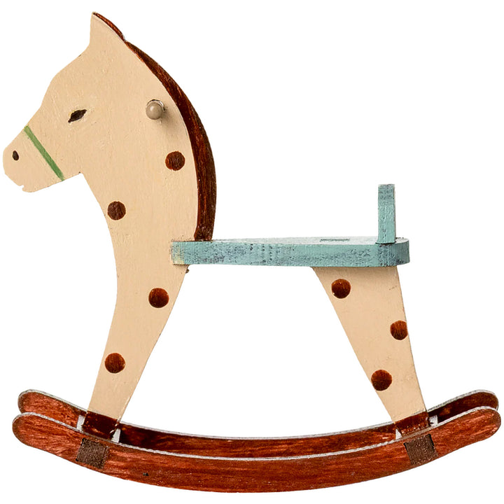 A charming scene featuring the Maileg Spotted Mouse Rocking Horse styled as dollhouse furniture.