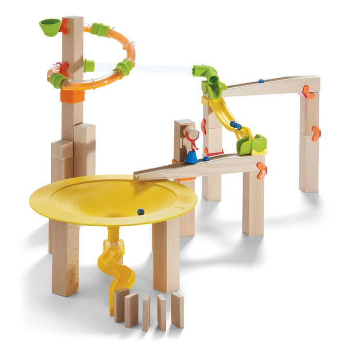 Roll marbles and race through tracks with HABA Marble Run Funnel Jungle Starter Set, a fun wooden toy for kids.