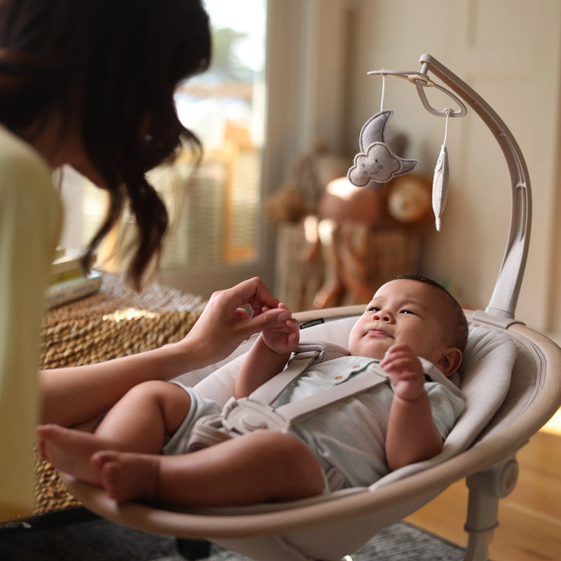 Maxi Cosi Cassia Swing in neutral tones, offering adjustable recline and soothing motions, an ideal maxi cosi swing.