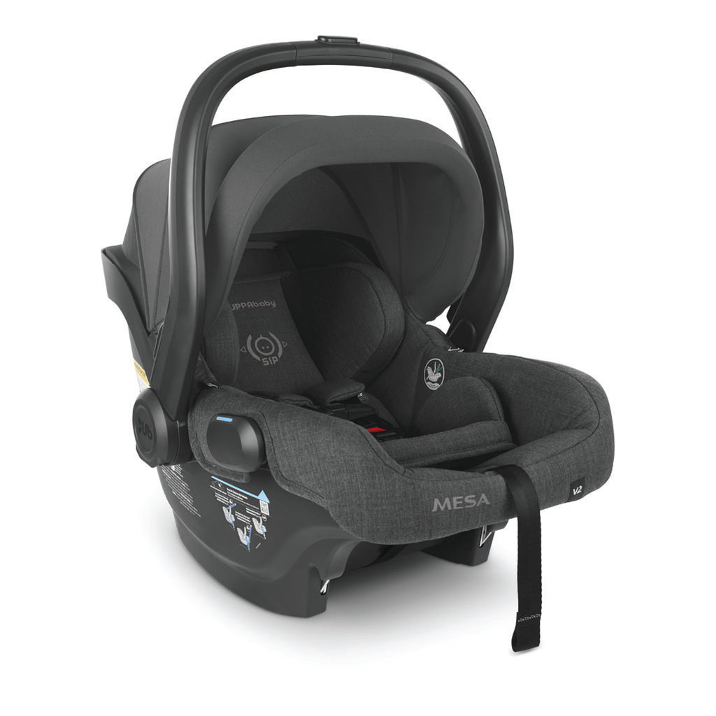 Right view of mesa v2 carseat in color greyson with handle and canopy up.