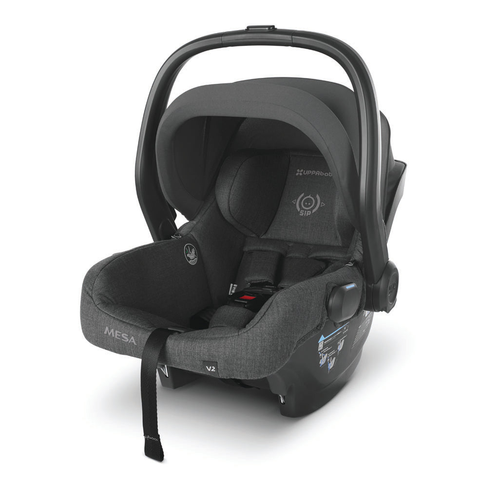 Left view of mesa v2 carseat in color greyson with handle and canopy up.