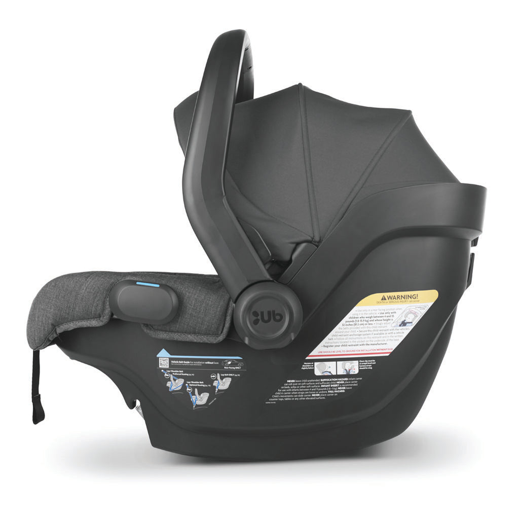 Left view of mesa v2 carseat with handle and canopy up in grey.
