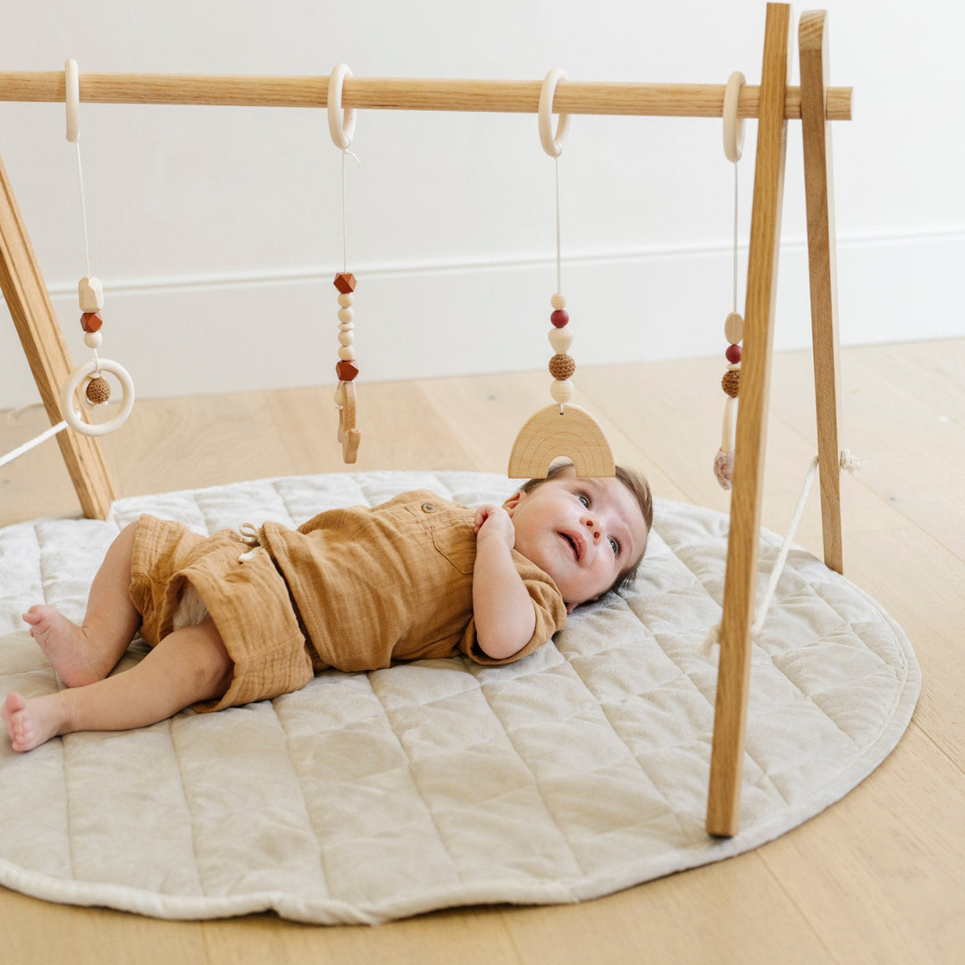 The Moonbeam Saranoni Minky Play Mat is intentionally cushioned to serve as a gentle Play mat for infant comfort.