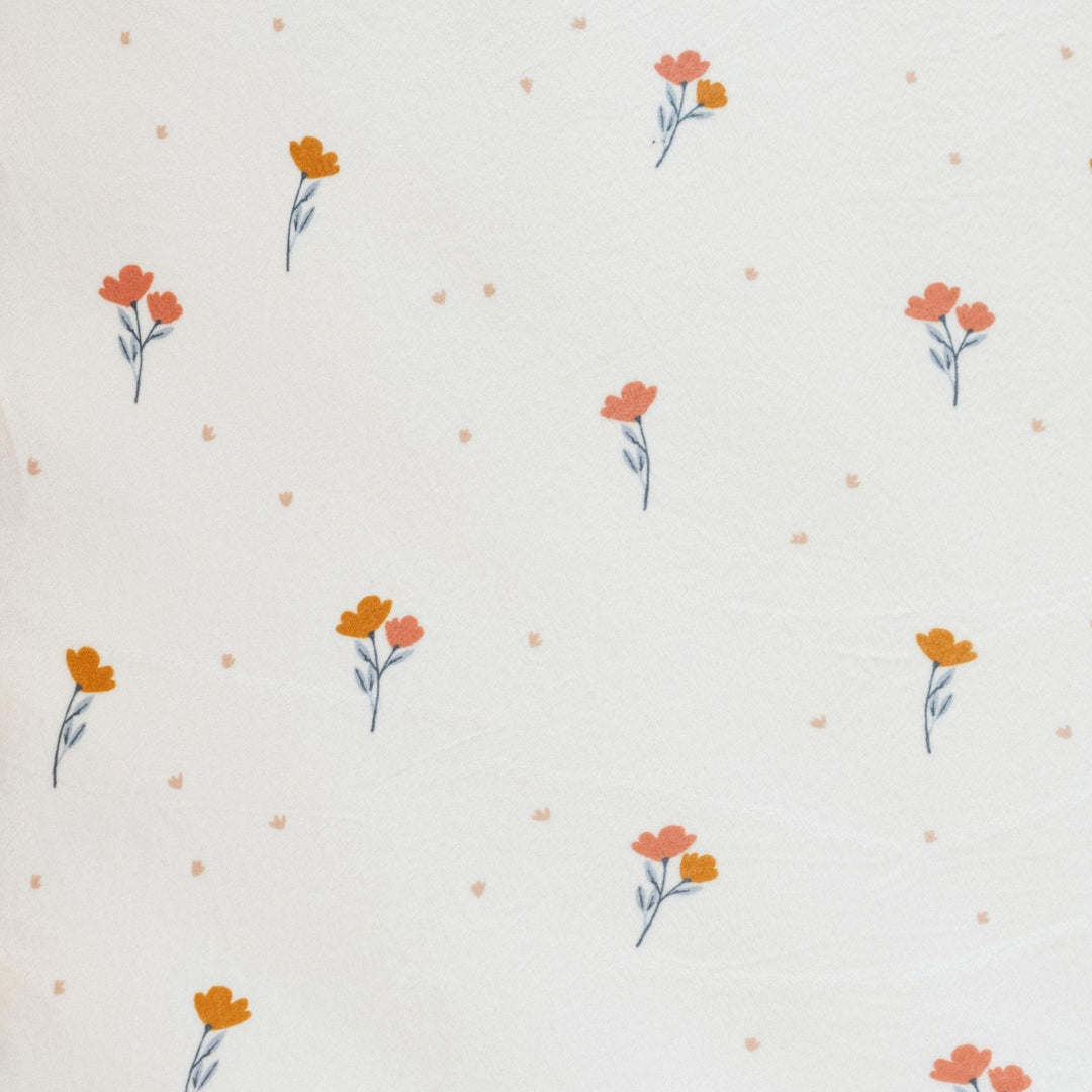 The Saranoni Minky Stretch Luxe Changing Covers in Floral add cozy support and function as the ideal changing table pad cover