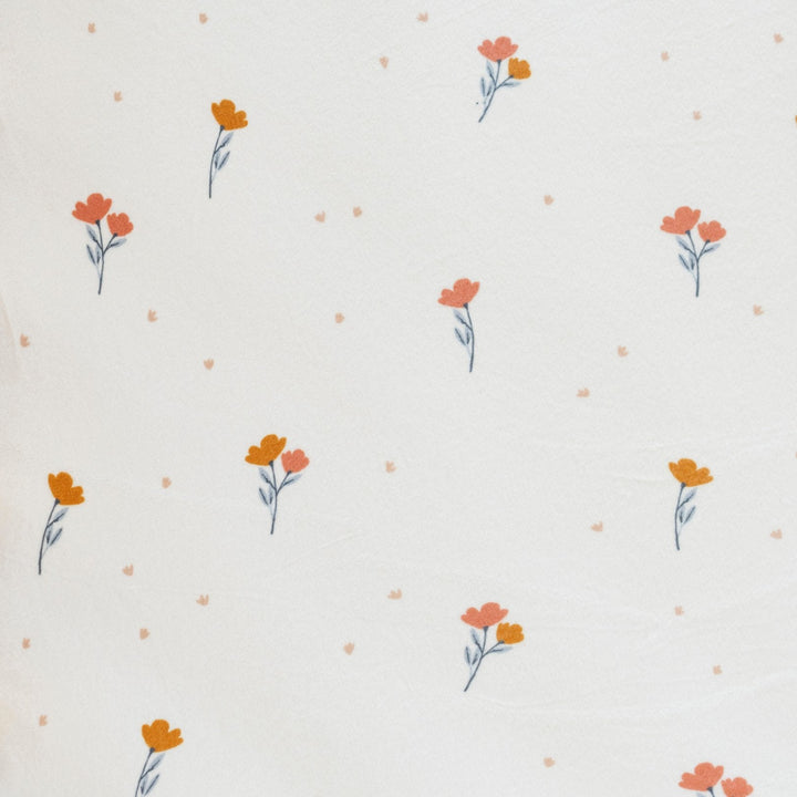 The Saranoni Minky Stretch Luxe Changing Covers in Floral add cozy support and function as the ideal changing table pad cover