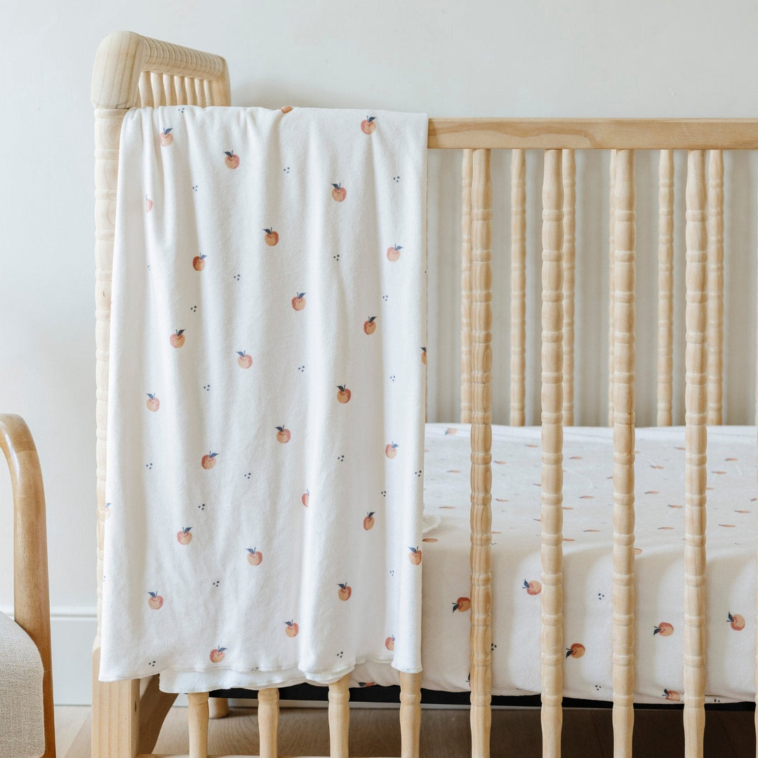Plush, stretchy, and luxe Ñ the Saranoni Minky Stretch Luxe Swaddle/Blanket in Apple mimics a baby knit blanket feel.