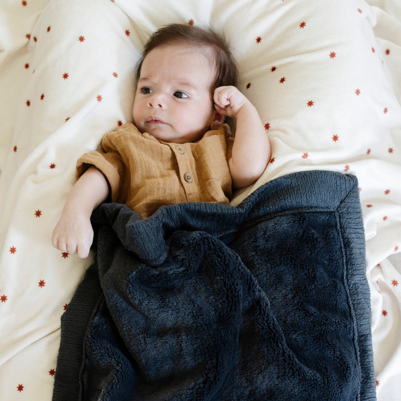 When looking for swaddle blankets that feel next-level plush, the Saranoni Minky Stretch Luxe Swaddle/Blanket in Stars stands out.