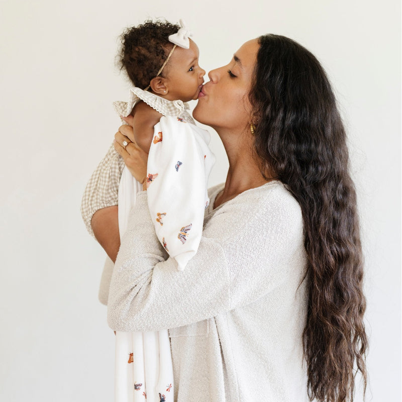 Parents wanting elevated basics choose the Saranoni Minky Stretch Luxe Swaddle/Blanket in Butterfly as their go-to baby boy blanket.